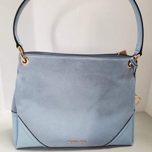 Light blue, suede Michael Kors purse.